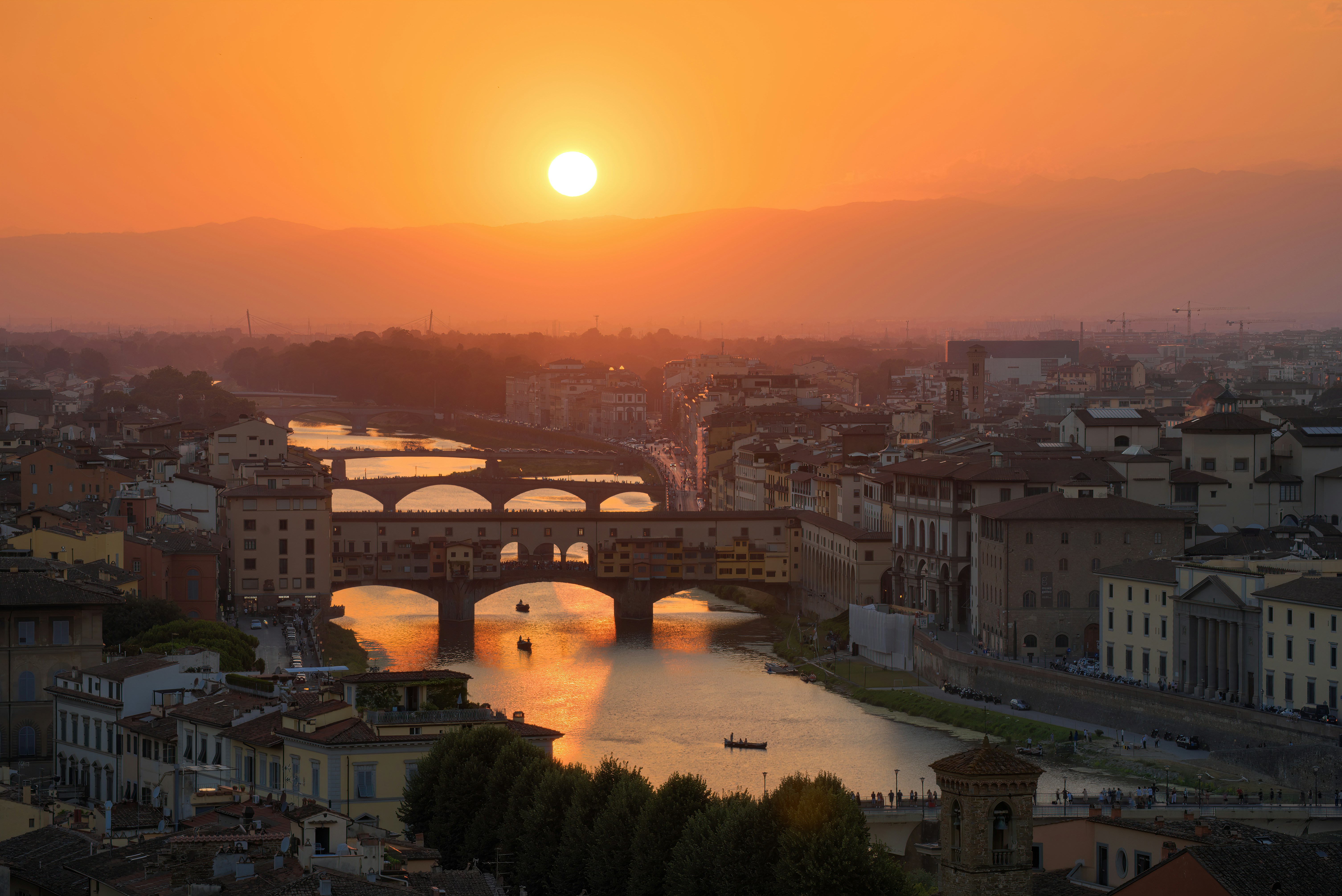 Ponte Vecchio in Florence at golden sunset, symbolizing the bridge between Italy and South Korea